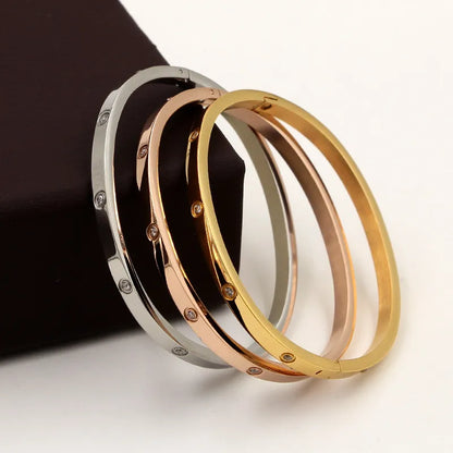 Beautiful stainless steel bracelets set with cubic zirconias in shades of gold, rose gold and silver