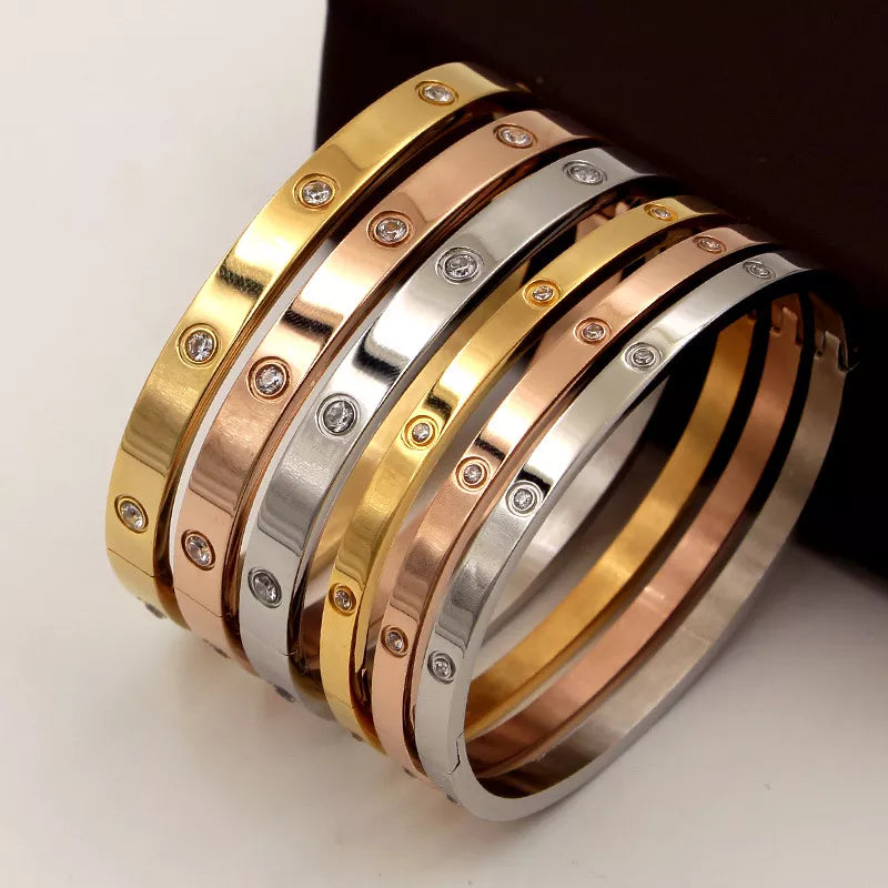 Beautiful stainless steel bracelets set with cubic zirconias in shades of gold, rose gold and silver