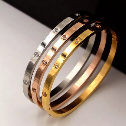 Beautiful stainless steel bracelets set with cubic zirconias in shades of gold, rose gold and silver